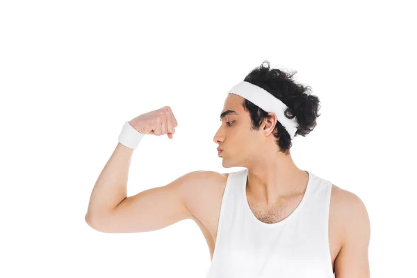 Side view of young thin sportsman showing muscles on hand isolated on white — Stock Photo