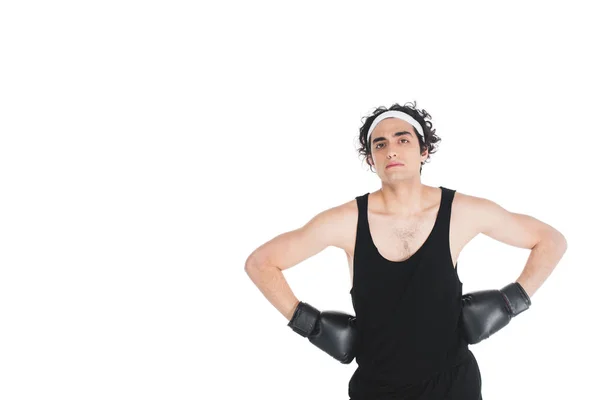 Young thin sportsman in boxing gloves holding hands on waist isolated on white — Stock Photo