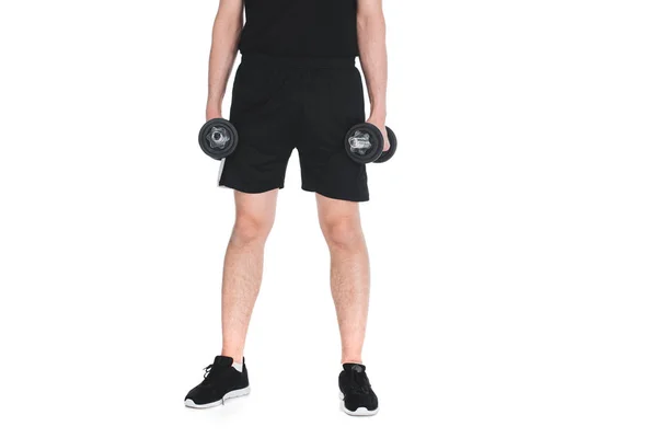 Cropped image of skinny sportsman with dumbbells in hands isolated on white — Stock Photo