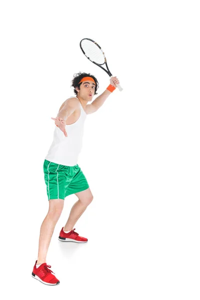 Thin sportsman in headband standing with racket isolated on white — Stock Photo