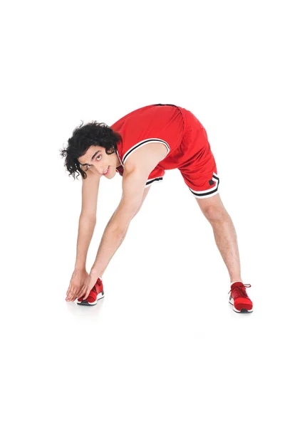 Young skinny sportsman doing exercise isolated on white — Stock Photo