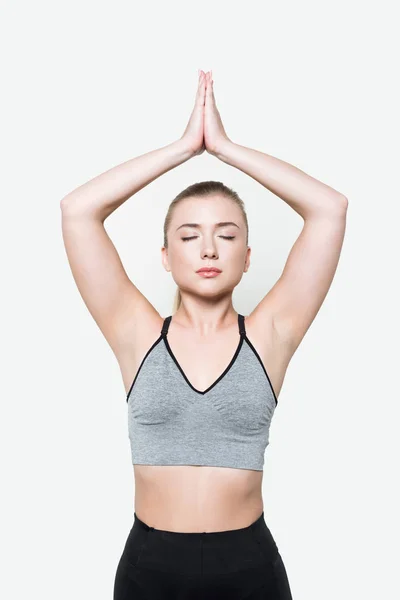 Frau führt Yoga-Übungen isoliert auf Weiß durch — Stockfoto