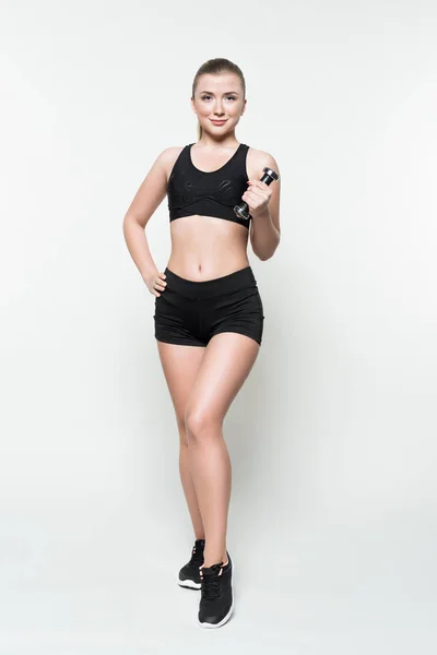 Allenamento fitness donna con manubri isolati su bianco — Foto stock