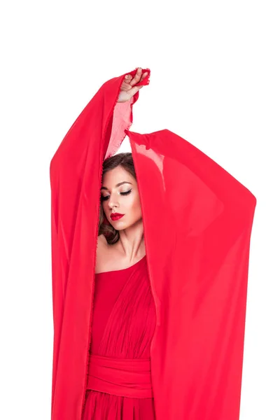 Glamorous girl posing in red dress with veil, isolated on white — Stock Photo