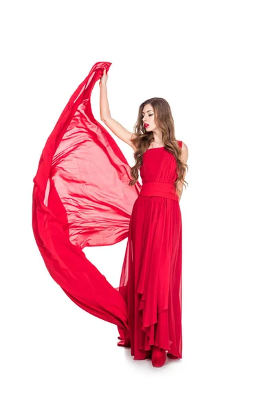 Гламурная девушка позирует в красном платье с вуалью, изолированные на белом — стоковое фото