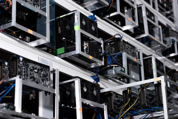 Bottom view of shelves with equipment at ethereum mining farm — Stock Photo