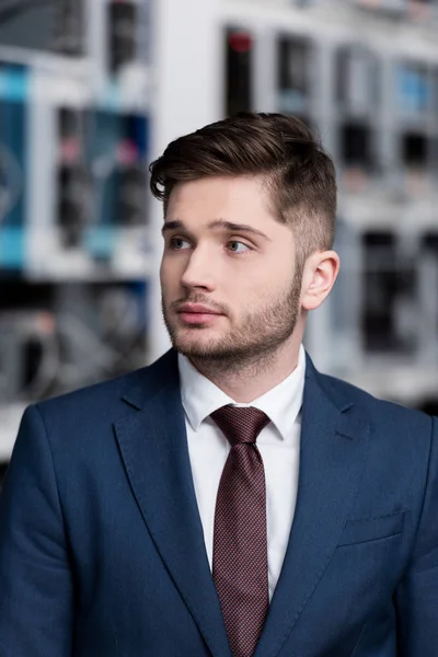 Close-up portrait of handsome young businessman at cryptocurrency mining farm — Stock Photo