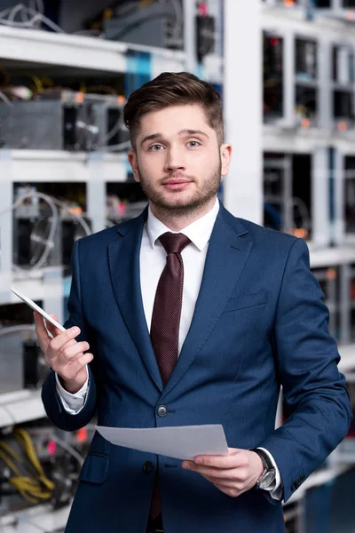 Successful young businessman at cryptocurrency mining farm — Stock Photo