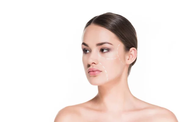 Schöne junge Frau mit gestrichelten Linien im Gesicht für plastische Chirurgie isoliert auf weiß gezeichnet — Stockfoto