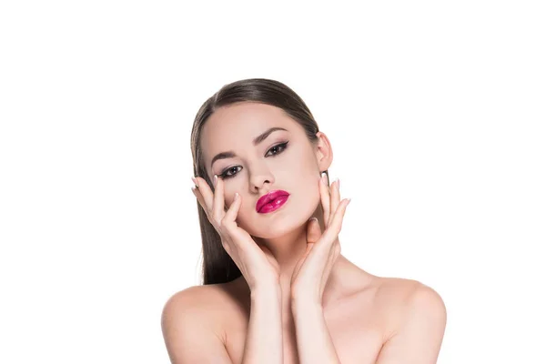 Attraktive junge Frau mit roten Lippen, die ihr Gesicht isoliert auf weiß berührt — Stockfoto