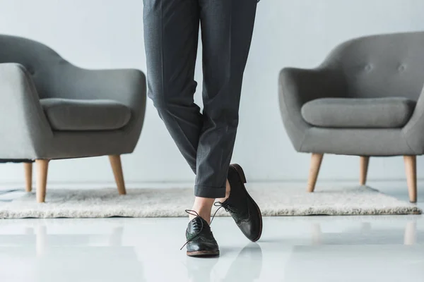 Close-up view of female feet in leather shoes — Stock Photo