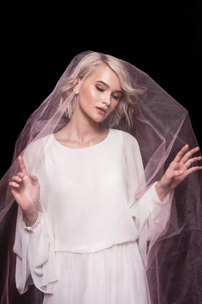 Blonde girl posing in pink veil, isolated on black — Stock Photo