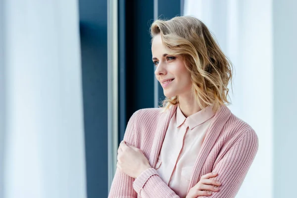 Portrait of beautiful thoughtful woman in pink blouse and jacket looking away — Stock Photo