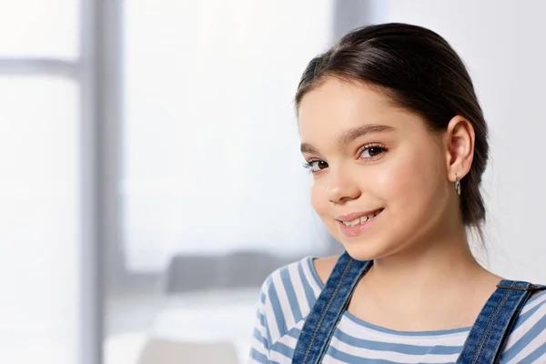 Portrait of adorable preteen child looking at camera at home — Stock Photo