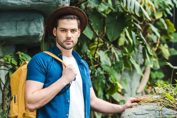 Handsome young man in stylish clothes in rainforest — Stock Photo