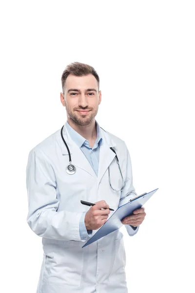 Young male doctor with stethoscope and diagnosis isolated on white background — Stock Photo