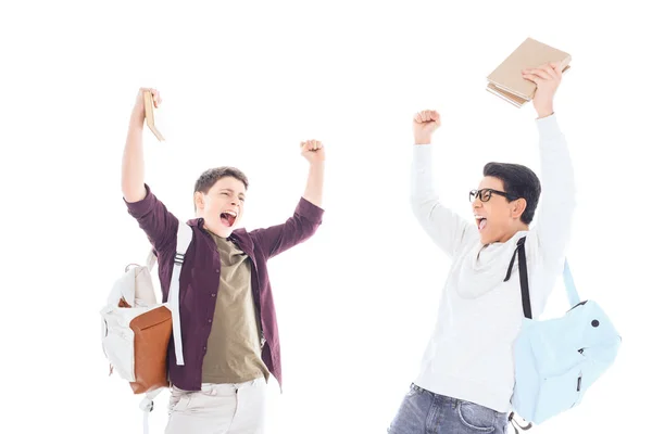 Felici studenti multietnici con zaini e libri isolati su bianco — Foto stock