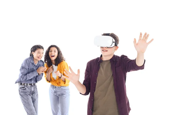 Laughing teenage students having fun with vr headset isolated on white — Stock Photo