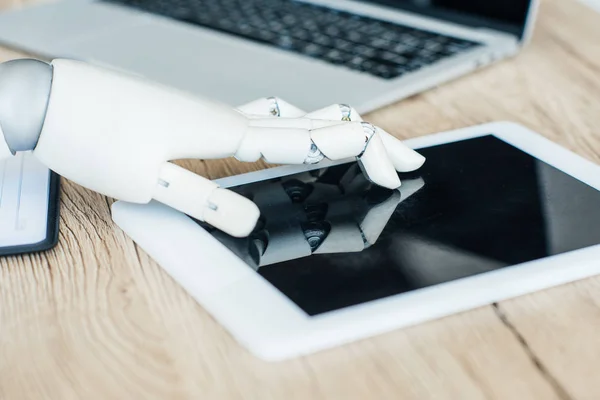 Close-up view of robot using digital tablet with blank screen — Stock Photo