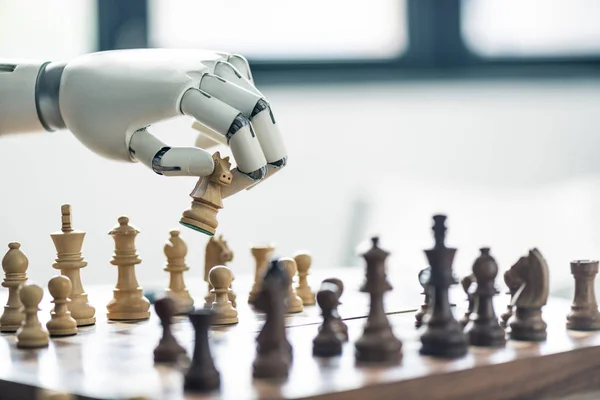 Close-up view of robot playing chess, selective focus — Stock Photo