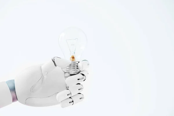 Close-up view of hand of robot holding light bulb isolated on white — Stock Photo