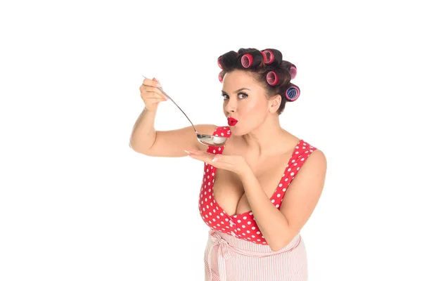 Emotional plus size housewife cooking with ladle looking at camera isolated on white — Stock Photo