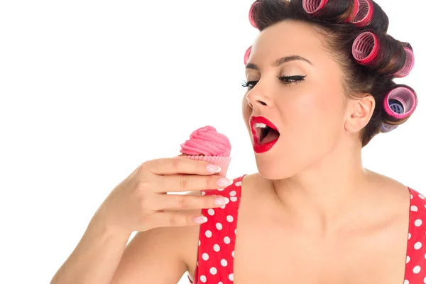 Close-up portrait of plus size woman eating cupcake isolated on white — Stock Photo