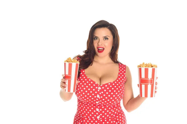 Excited plus size woman with boxes of popcorn isolated on white — Stock Photo