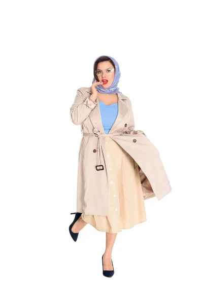 Beautiful plus size woman in stylish trench coat and kerchief isolated on white — Stock Photo
