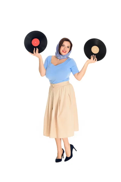 Full length view of beautiful size plus pin up woman holding vinyl records and smiling at camera isolated on white — Stock Photo