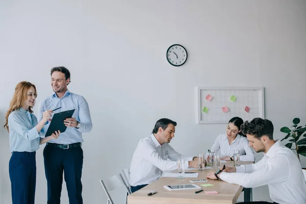 Business coworkers having discussion during business training in office — Stock Photo