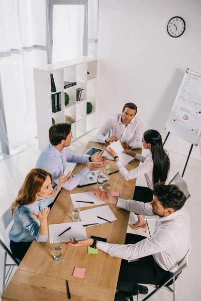 High angle view of business colleagues discussing business idea at workplace in office — Stock Photo