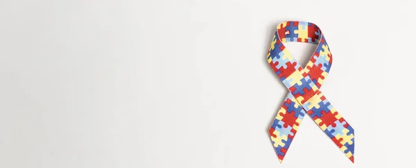 Panoramic shot of symbol of autism on grey background — Stock Photo