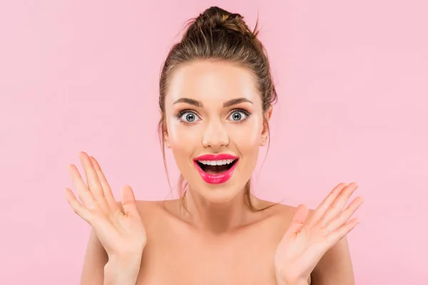 Shocked naked beautiful woman with pink lips isolated on pink — стоковое фото