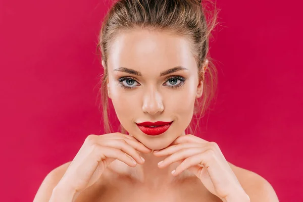 Naked beautiful woman with red lips posing isolated on red — Stock Photo