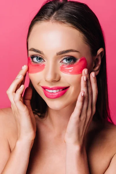 Smiling naked beautiful woman with eye patch on face isolated on pink — Stock Photo