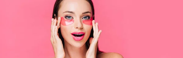 Excited naked beautiful woman touching eye patch on face isolated on pink, panoramic shot — Stock Photo