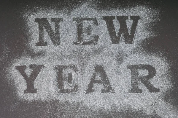 Top view of New Year lettering on snow — Stock Photo