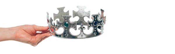 Cropped view of woman holding antique silver crown, isolated on white, panoramic shot — Stock Photo