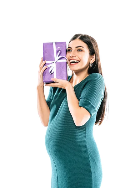 Happy pregnant girl holding present isolated on white — Stock Photo