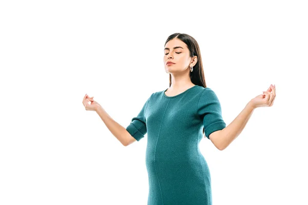 Pregnant girl with closed eyes meditating isolated on white — Stock Photo