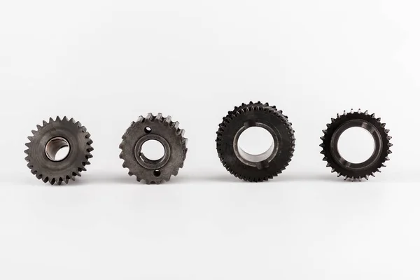 Metal round gears in row on white background — Stock Photo