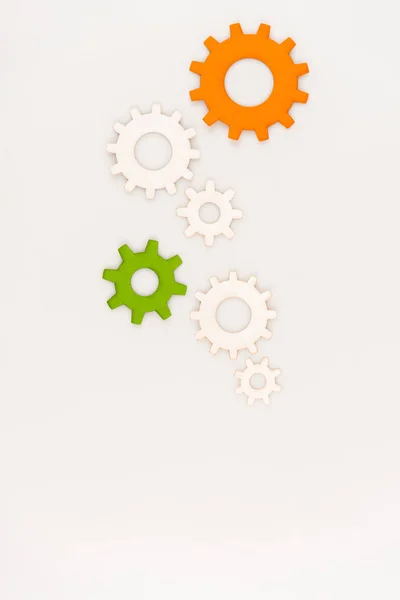 Top view of colorful gears isolated on white — Stock Photo