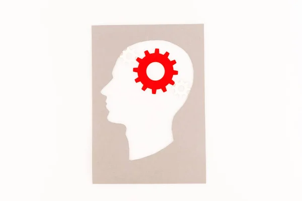 Draufsicht der menschlichen Kopf-Silhouette mit rotem Getriebe isoliert auf weiß — Stockfoto