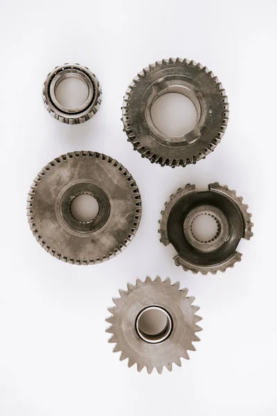 Top view of metal round gears on white background — Stock Photo