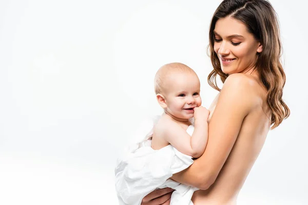 Portrait of cheerful naked mother holding baby, isolated on white — Stock Photo