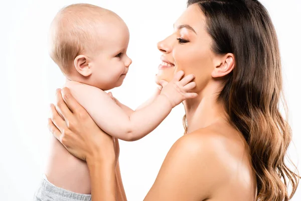 Portrait of positive naked mother holding baby, isolated on white — Stock Photo