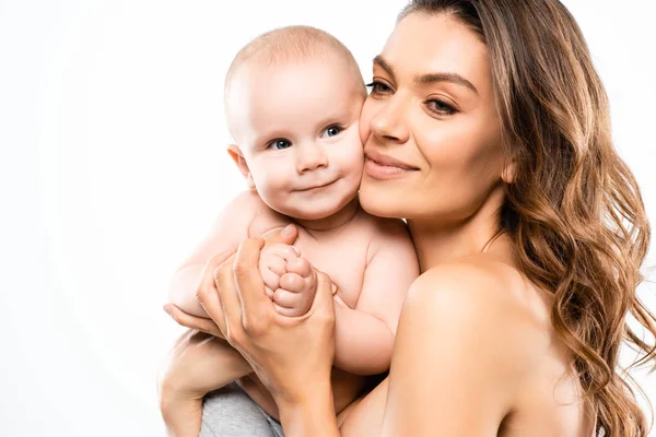 Portrait of cheerful naked mother holding baby, isolated on white — Stock Photo