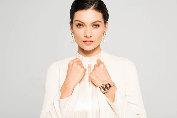 Beautiful confident businesswoman in white suit, isolated on grey — Stock Photo