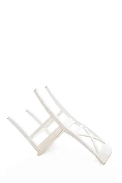 Перевернутий білий дерев'яний стілець ізольований на білому — стокове фото